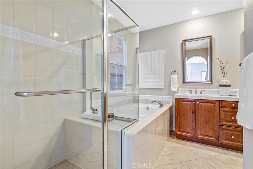 8 Ingleside Irvine, CA 92620 - Photo 24 of 74 a spacious bathroom with a tub sink and mirror