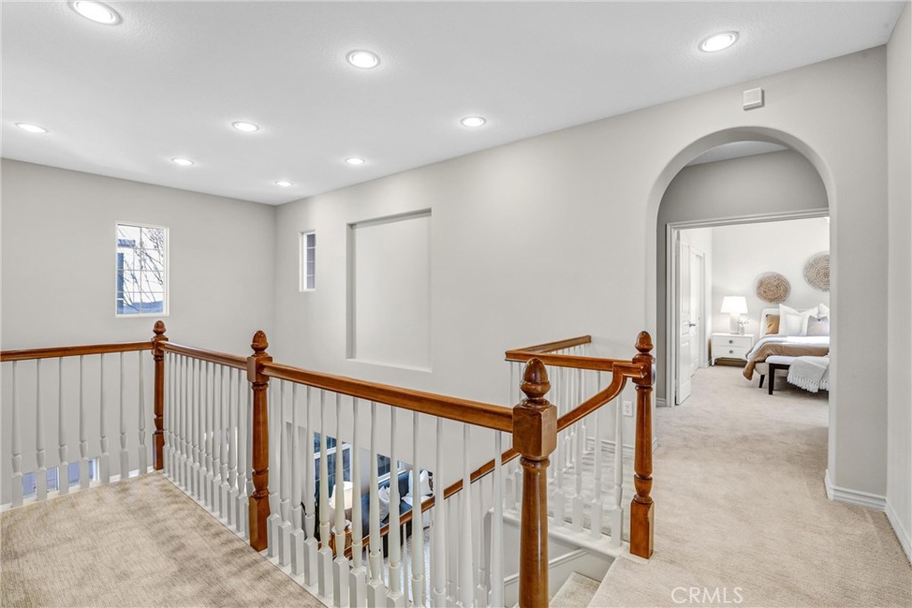 8 Ingleside Irvine, CA 92620 - Photo 33 of 74 a view of a hallway with wooden floor and stairs