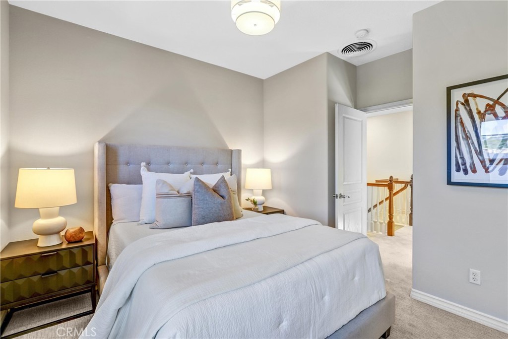 8 Ingleside Irvine, CA 92620 - Photo 35 of 74 a bedroom with a bed and a lamp