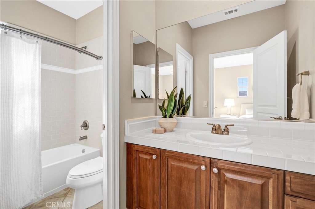 8 Ingleside Irvine, CA 92620 - Photo 42 of 74 a bathroom with a granite countertop sink toilet and shower