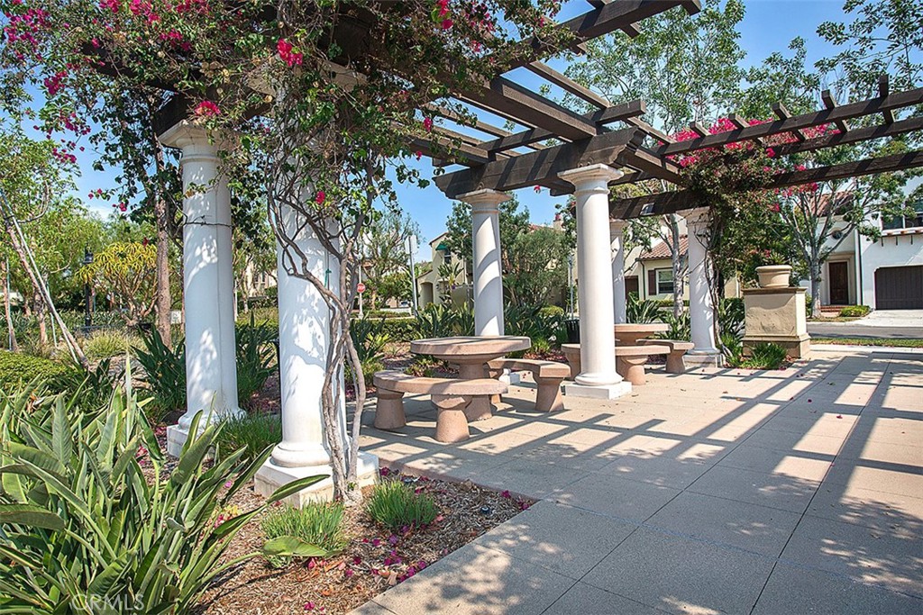 8 Ingleside Irvine, CA 92620 - Photo 64 of 74 a view of a patio with table and chairs and floor to ceiling window