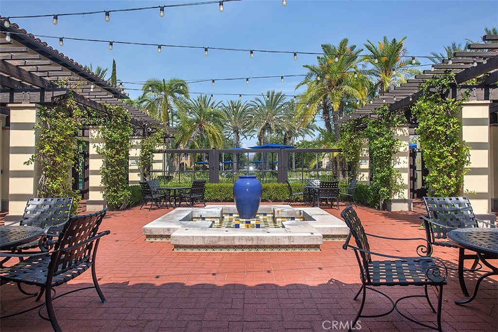 8 Ingleside Irvine, CA 92620 - Photo 72 of 74 a view of a patio with table and chairs and potted plants