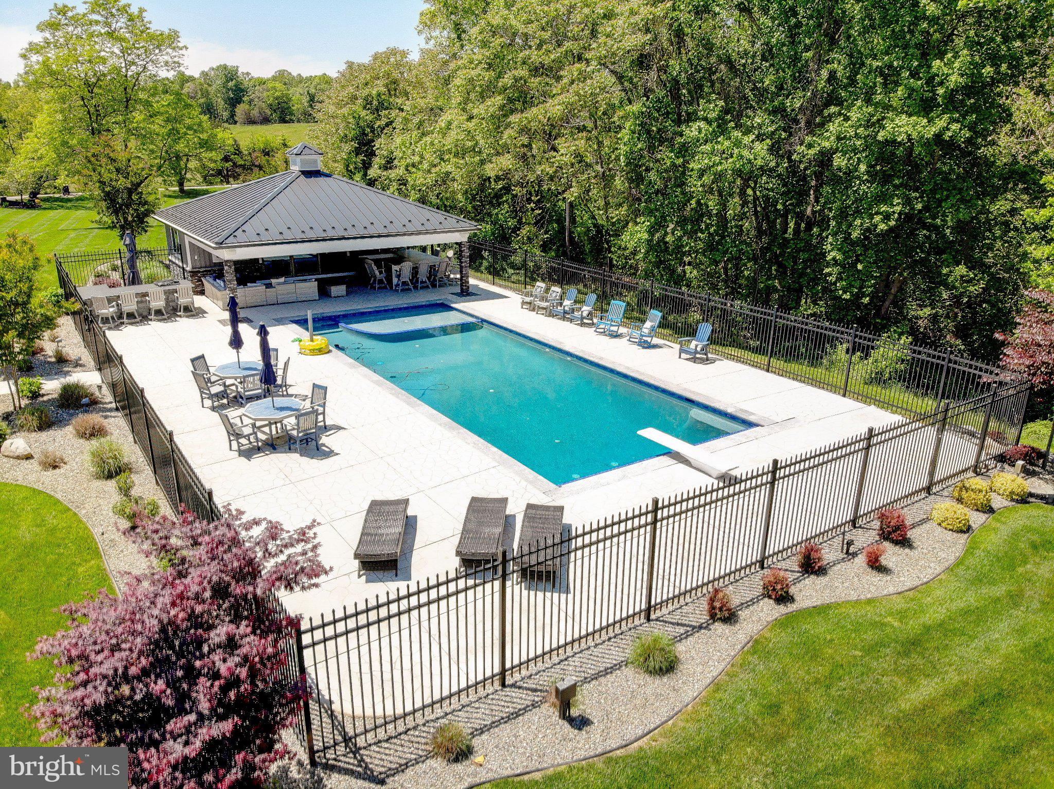 2393 Garrity Road St. Leonard, MD 20685 - Photo 9 of 14 Serene oasis with a sparkling pool.