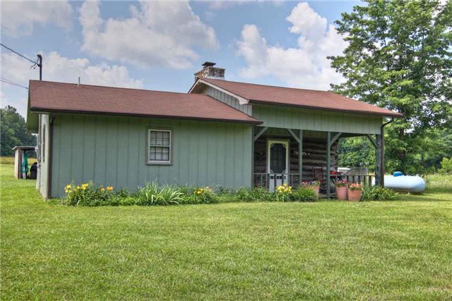 2904 West Trimble Road Milton, TN 37118 - Photo 1 of 11 Country living with log cabin charm and flair!! Tree lined creek between the home and the road with no neighbors across the road. Carport is a 12x16 shed with underground electric and also has additional 9.5x16' lean to for storage.