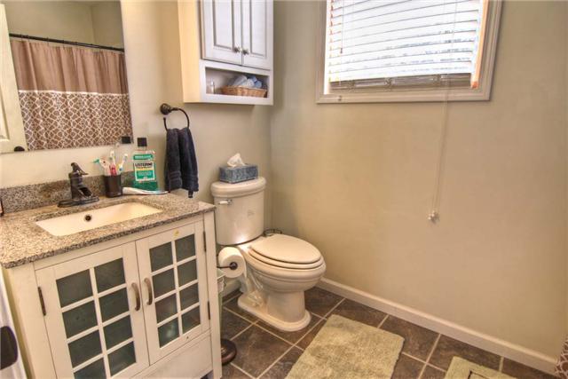 2904 West Trimble Road Milton, TN 37118 - Photo 11 of 11 Master bath is rich with charm and invites you to enjoy leisure dressing time while beginning your day. The master bath shares a second hot water tank with the laundry room. No fear of ever running out of hot water in this cabin!