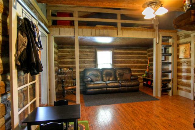 2904 West Trimble Road Milton, TN 37118 - Photo 5 of 11 Standing at the front door you can see the loft and the nice open expanse. Addt'l storage access in loft. Updated electric, wiring, smoke detectors, and more! The logs in the living room are from an old smokehouse built in the 1800s. c