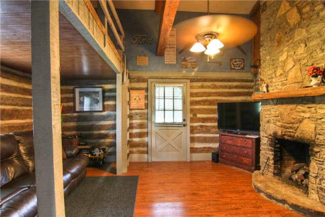 2904 West Trimble Road Milton, TN 37118 - Photo 6 of 11 Looking toward the front entrance you can view the dual rock fireplace. Fireplace opens to kitchen and den!! Fireplace has been converted to gas logs by Universal Heating & Cooling!!