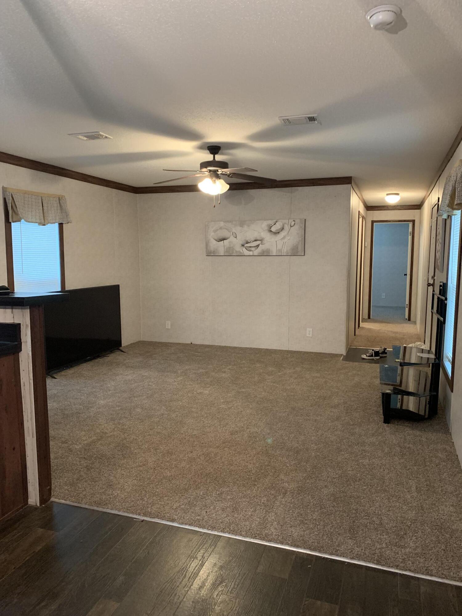 6214 Barnes Road Crestview, FL 32536 - Photo 4 of 23 a view of a big room with wooden floor