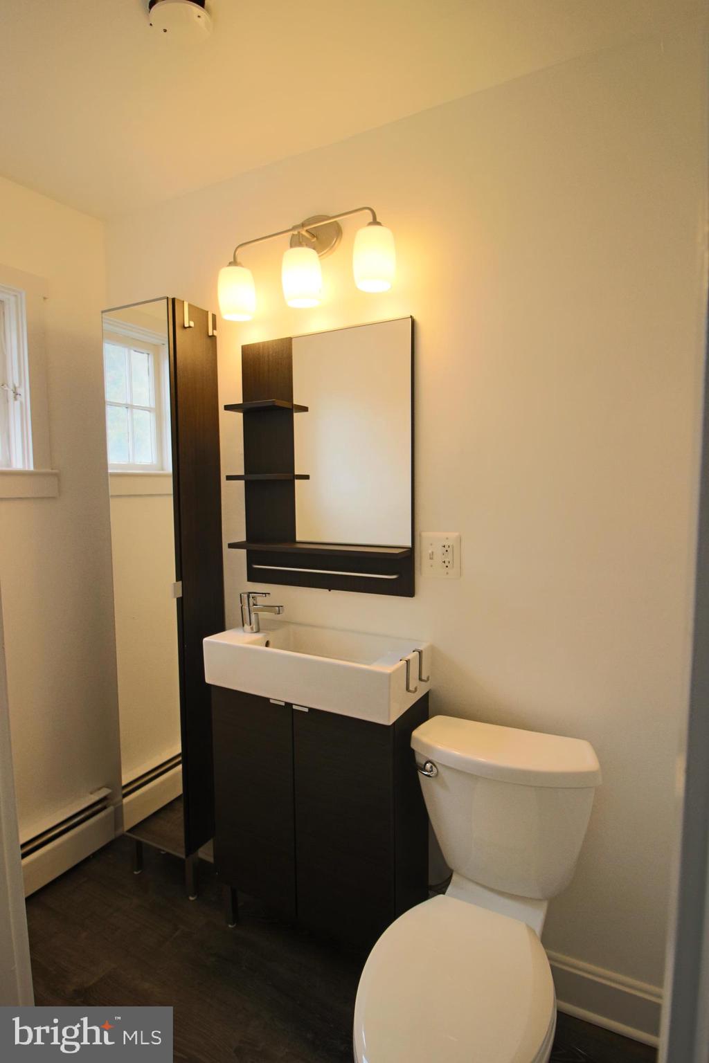 1606 Ruxton Road Edgewater, MD 21037 - Photo 16 of 26 a bathroom with a sink and a toilet