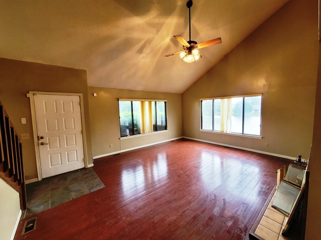 2601 Rachel Road Champaign, IL 61822 - Photo 7 of 22 a view of an empty room with wooden floor and a window