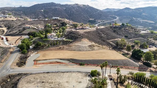 an aerial view of residential houses and outdoor space