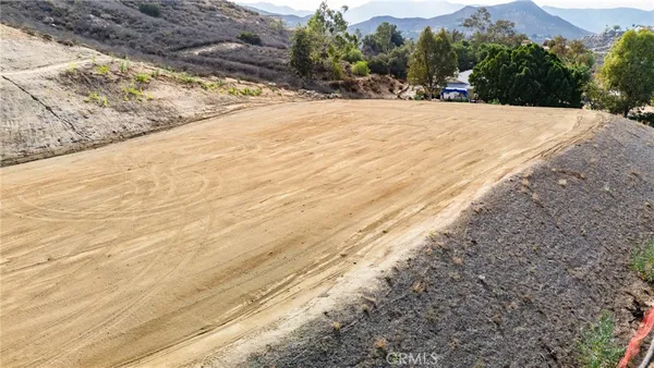 a view of outdoor space with wooden fence