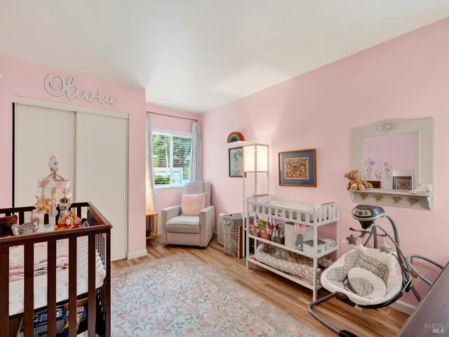 a bedroom with furniture and a window