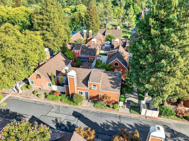 an aerial view of a house with a swimming pool
