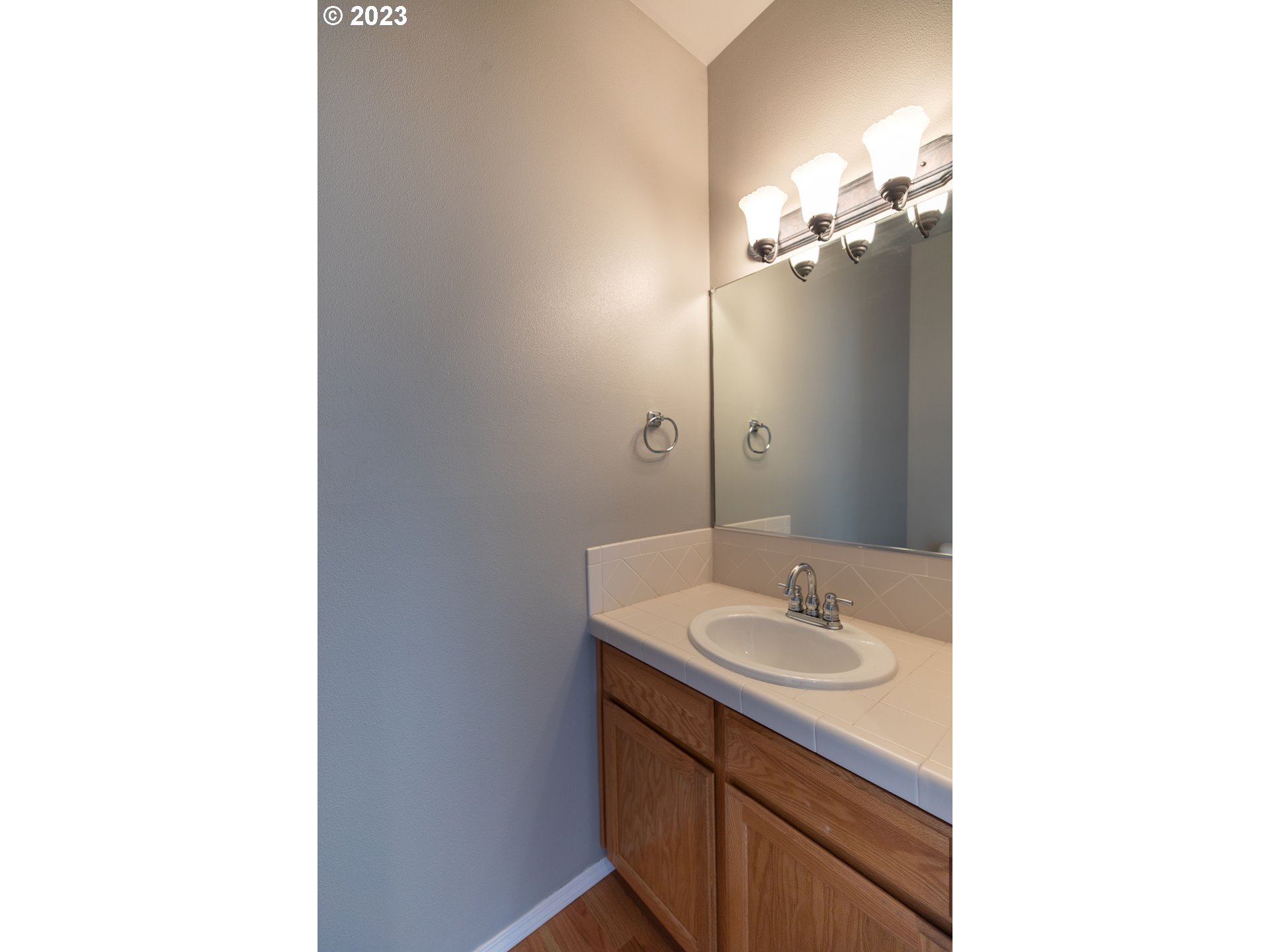 2399 Southwest Border Way Gresham, OR 97080 - Photo 19 of 48 a bathroom with a sink and a mirror