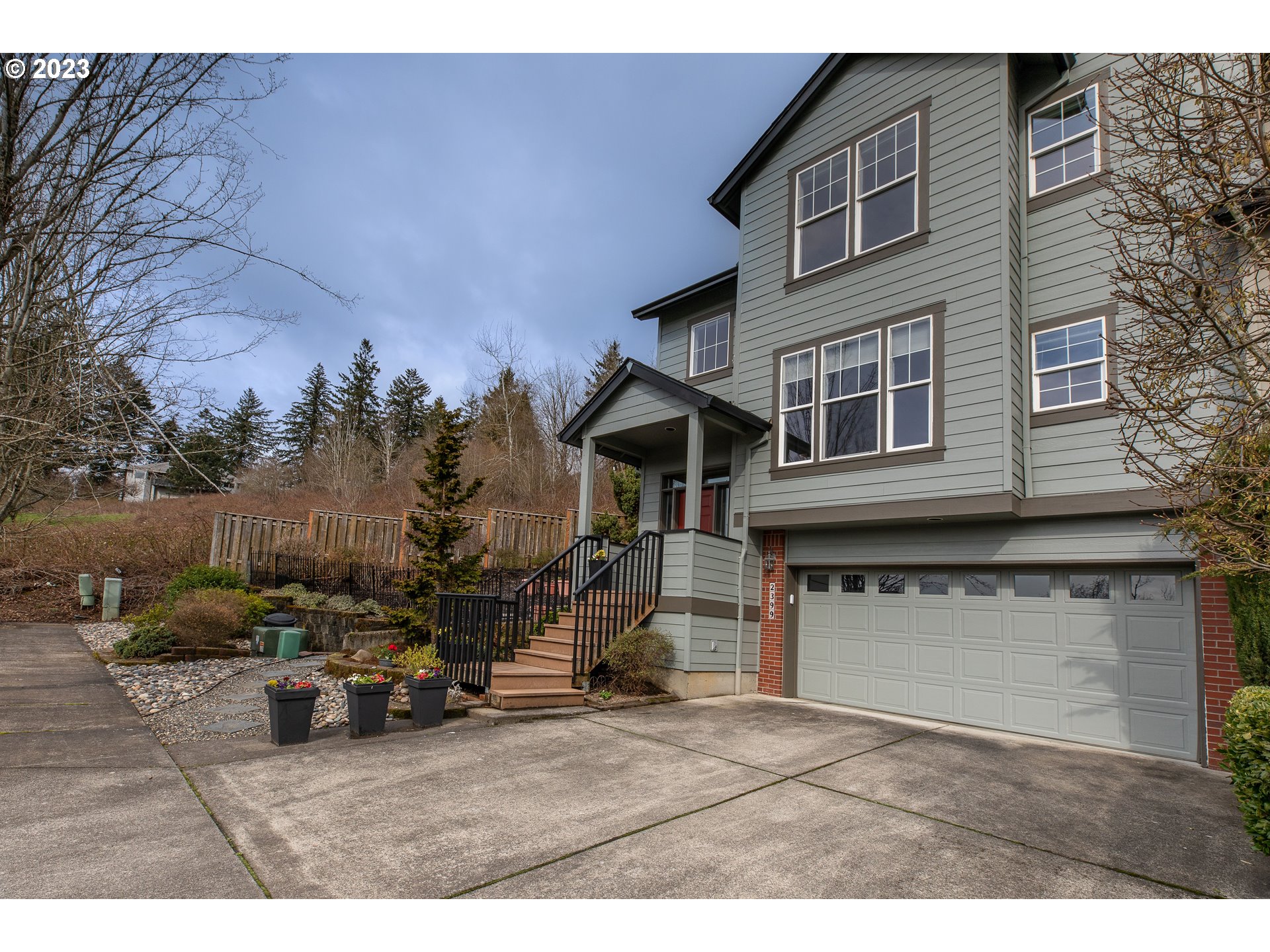 2399 Southwest Border Way Gresham, OR 97080 - Photo 3 of 48 a view of a house with a patio