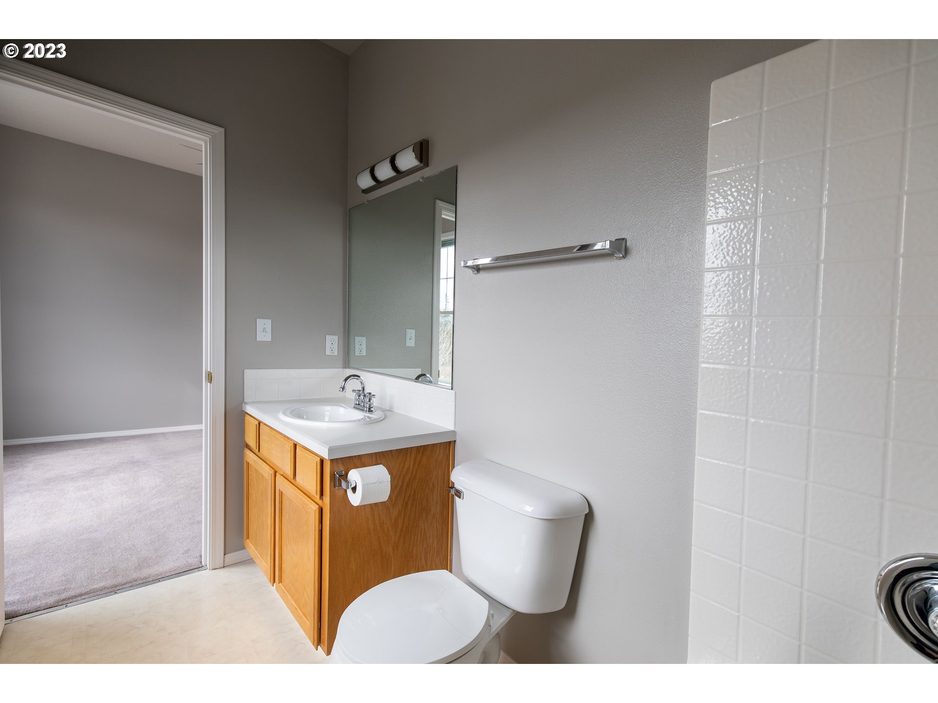 2399 Southwest Border Way Gresham, OR 97080 - Photo 36 of 48 a bathroom with a sink toilet and mirror