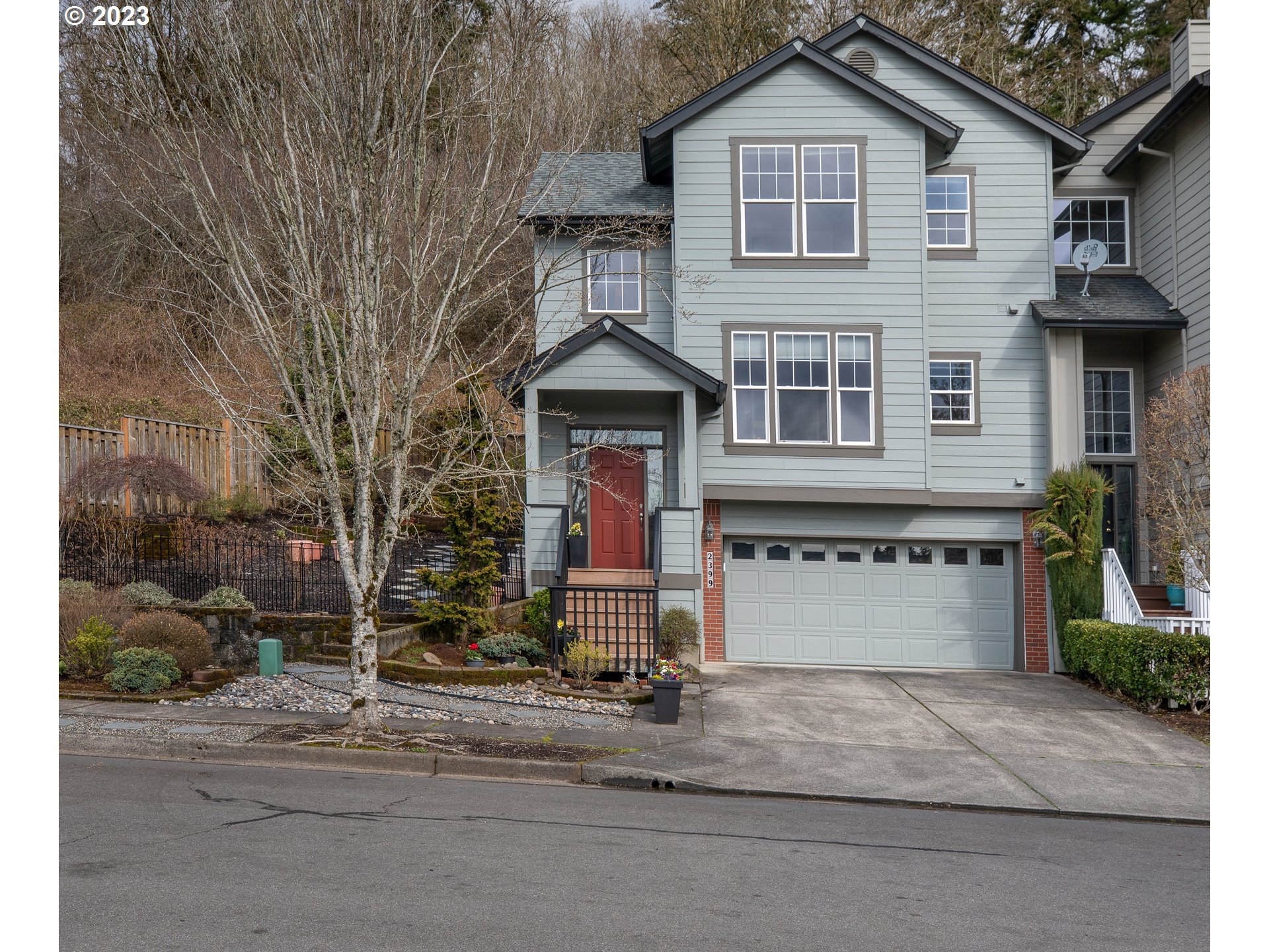 2399 Southwest Border Way Gresham, OR 97080 - Photo 46 of 48 a front view of a house with a yard and garage
