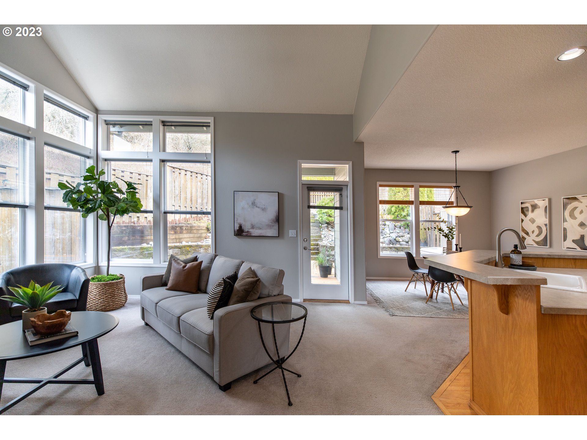2399 Southwest Border Way Gresham, OR 97080 - Photo 8 of 48 a living room with furniture and a large window