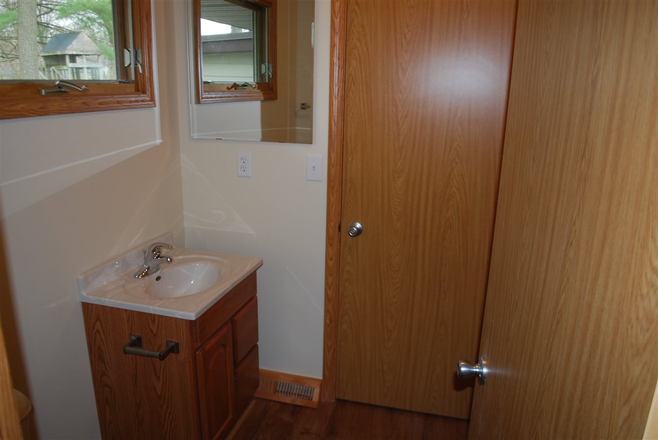 7941 Fairdale Road Cherry Valley, IL 61016 - Photo 15 of 18 a bathroom with a sink and mirror