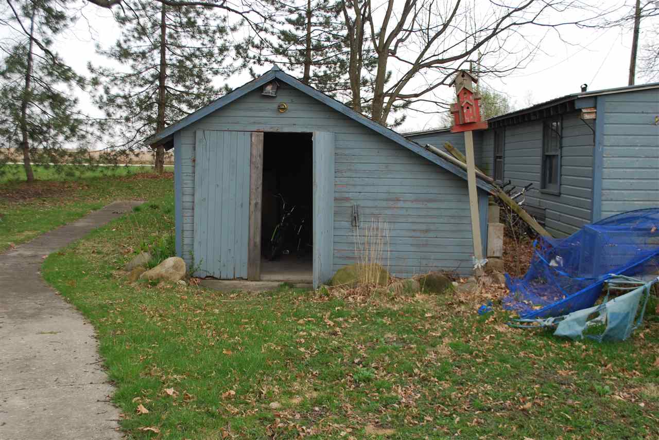 7941 Fairdale Road Cherry Valley, IL 61016 - Photo 18 of 18 a front view of a house with garden
