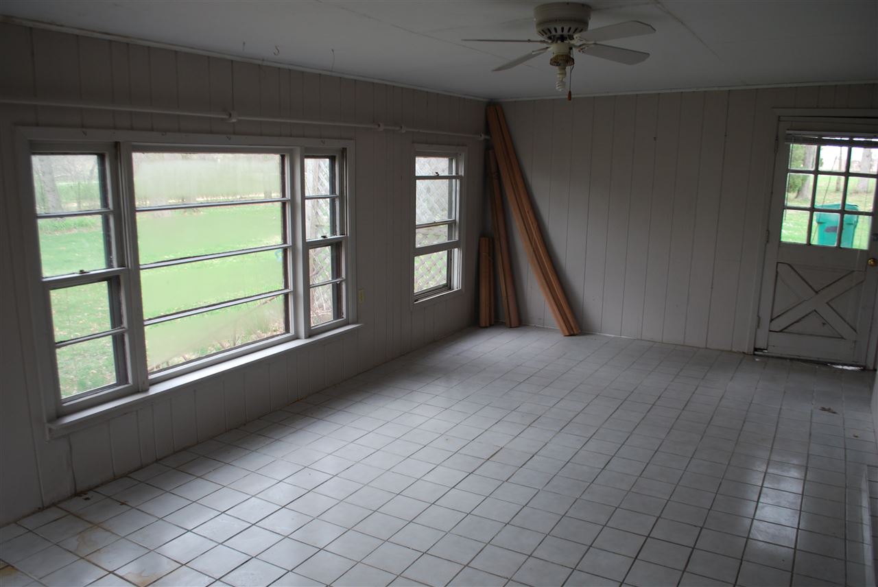 7941 Fairdale Road Cherry Valley, IL 61016 - Photo 6 of 18 a view of an empty room with a window