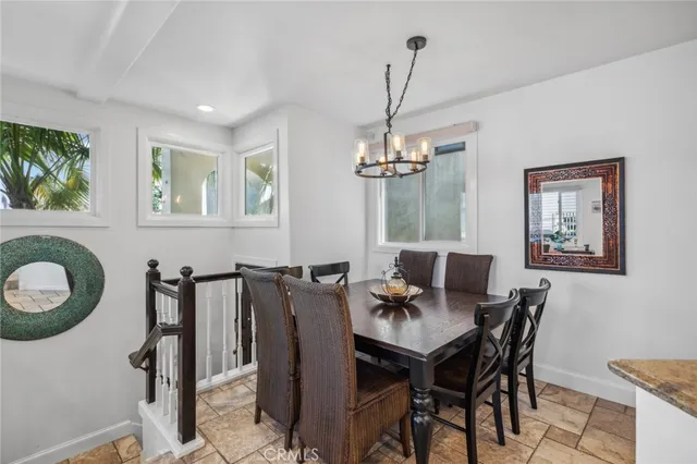 a view of a chairs and table in a balcony