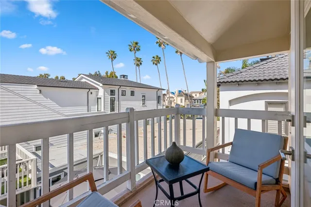 a view of a balcony with furniture