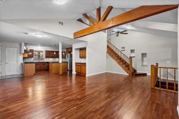 a view of kitchen with furniture and wooden floor