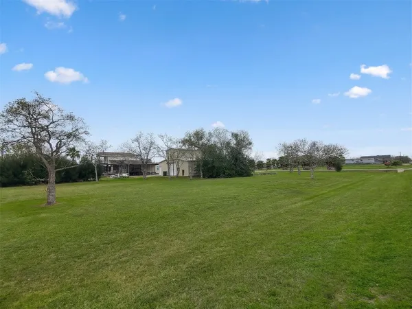 a view of outdoor space with deck and yard