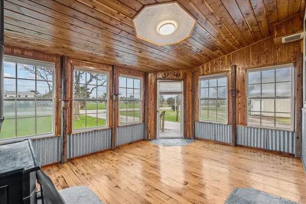a view of an empty room with a balcony