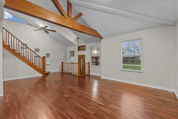a view of an entryway with wooden floor