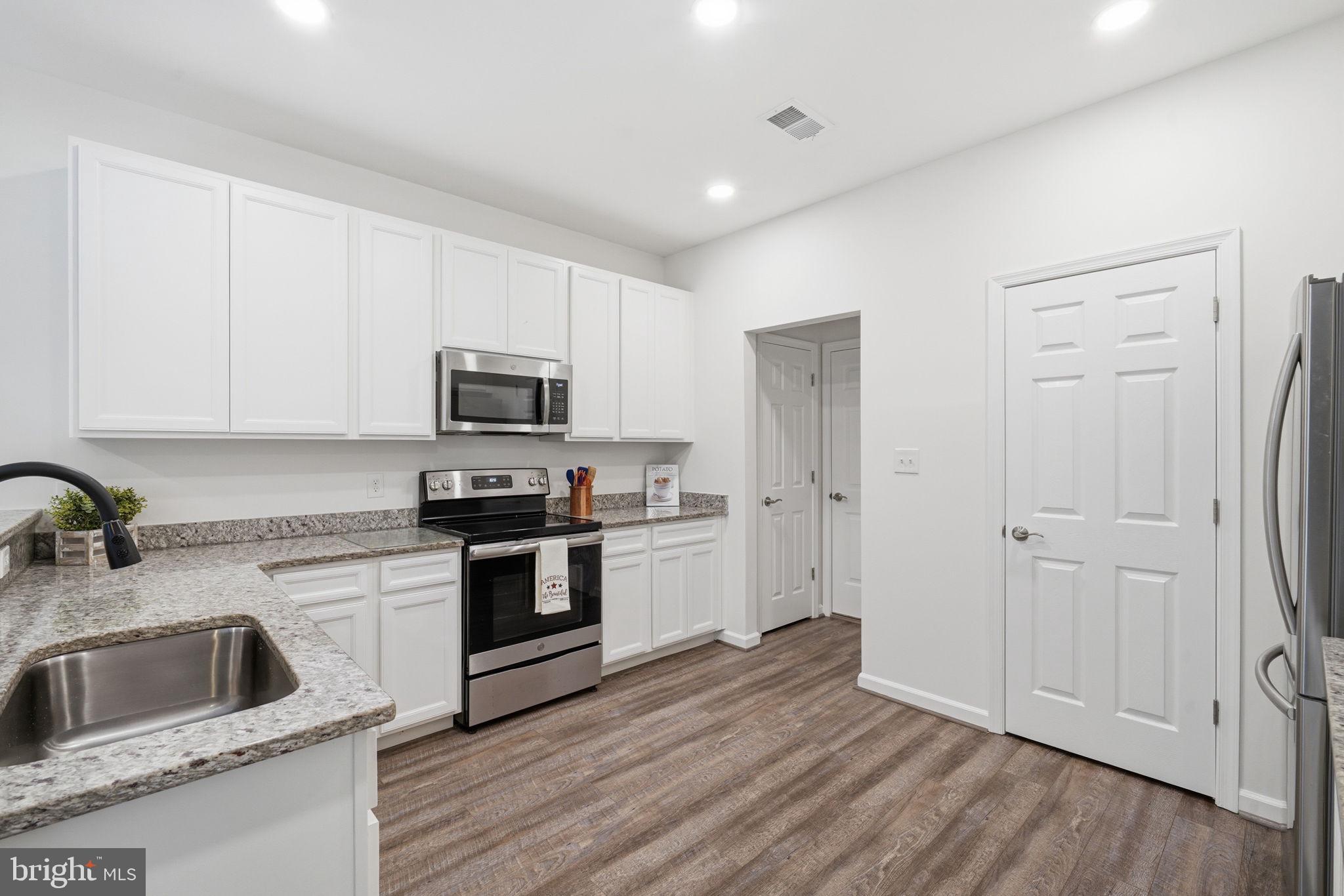 124 Riverside Drive Chester, MD 21619 - Photo 12 of 44 Modern kitchen with sleek finishes.