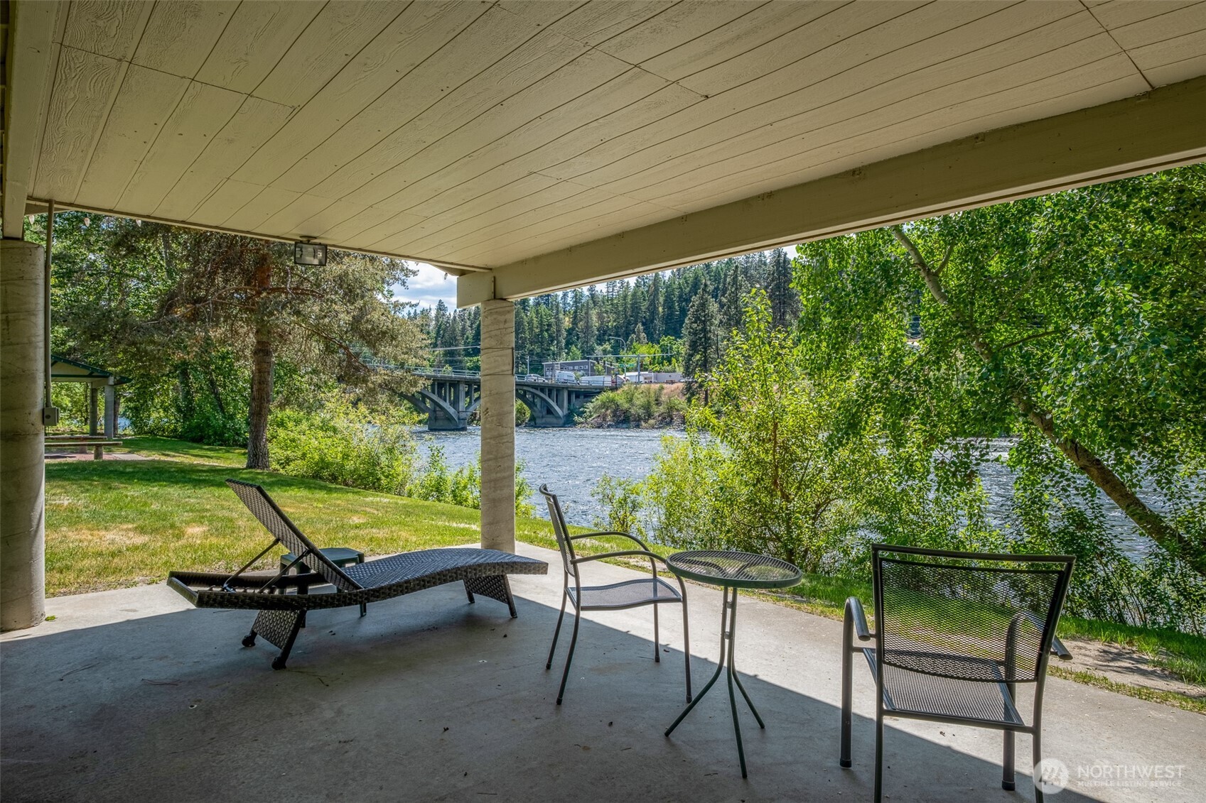 8348 Main Street, Unit 1 Peshastin, WA 98847 - Photo 18 of 40 a swimming pool with outdoor seating and yard