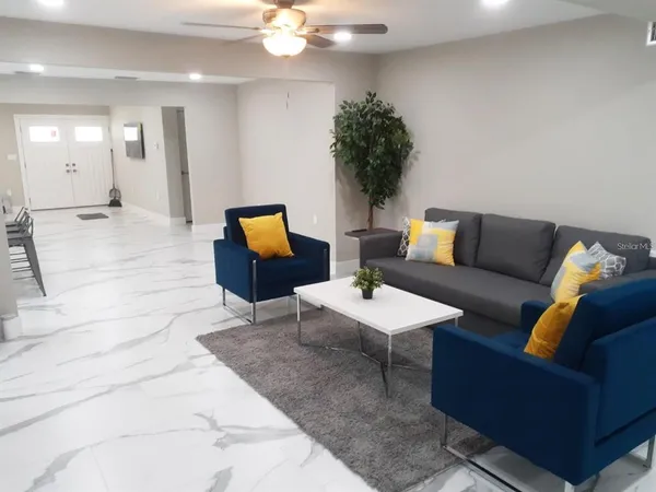 a living room with furniture and a flat screen tv