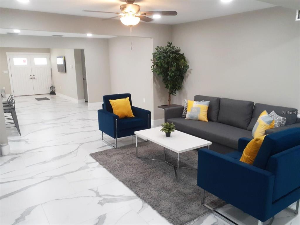 2042 Craft Lane Sarasota, FL 34239 - Photo 11 of 100 a living room with furniture and a chandelier