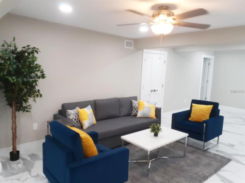 2042 Craft Lane Sarasota, FL 34239 - Photo 12 of 100 a living room with furniture a lamp and a potted plant