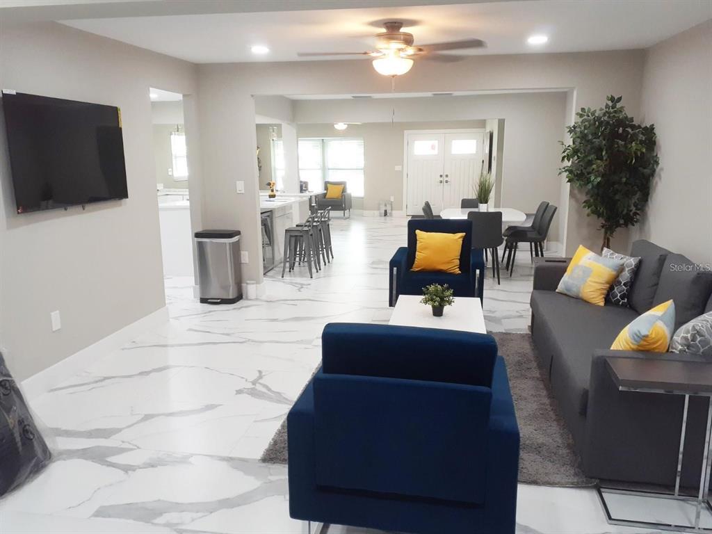 2042 Craft Lane Sarasota, FL 34239 - Photo 20 of 100 a living room with furniture and a flat screen tv