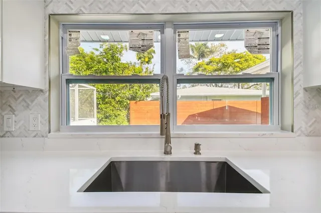 a view of a bedroom with washer and dryer