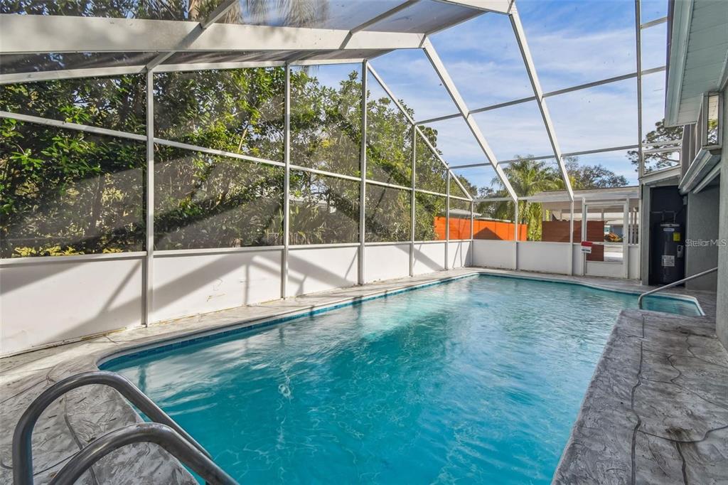2042 Craft Lane Sarasota, FL 34239 - Photo 35 of 100 a view of a swimming pool with a porch