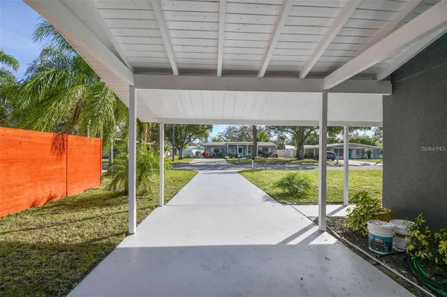 a kitchen with stainless steel appliances a sink and a refrigerator