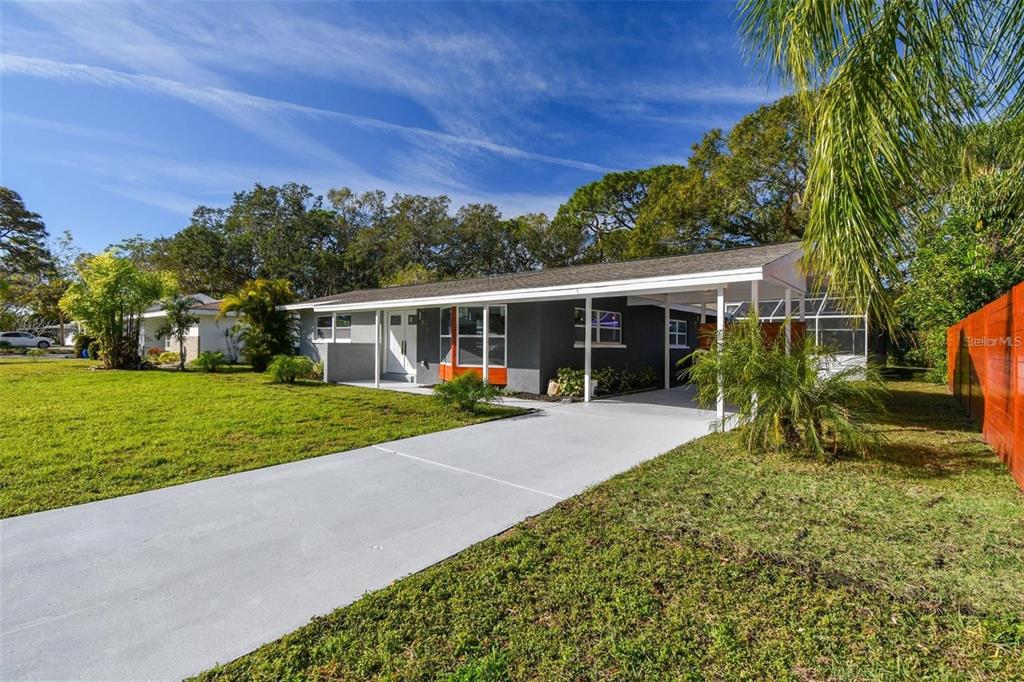 2042 Craft Lane Sarasota, FL 34239 - Photo 51 of 100 a view of a house with backyard and porch