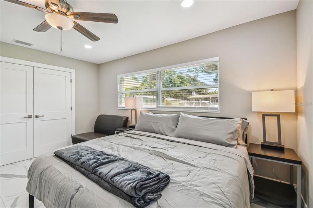 2042 Craft Lane Sarasota, FL 34239 - Photo 54 of 100 a bedroom with a large bed and a window