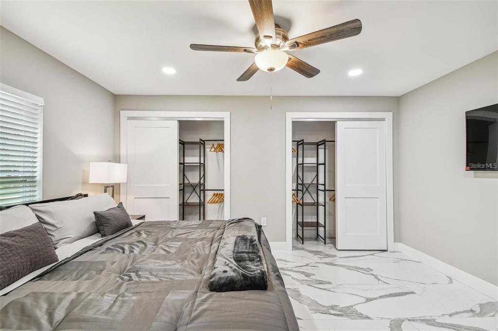 2042 Craft Lane Sarasota, FL 34239 - Photo 57 of 100 a bedroom with a large bed and a large window