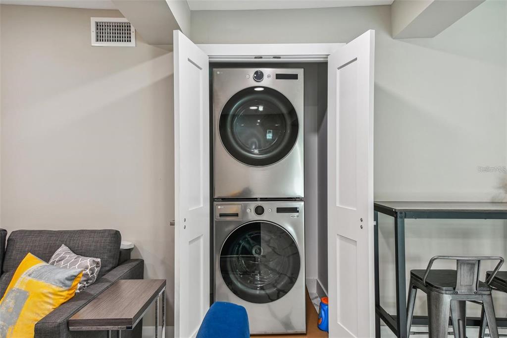 2042 Craft Lane Sarasota, FL 34239 - Photo 62 of 100 a view of a bedroom with washer and dryer