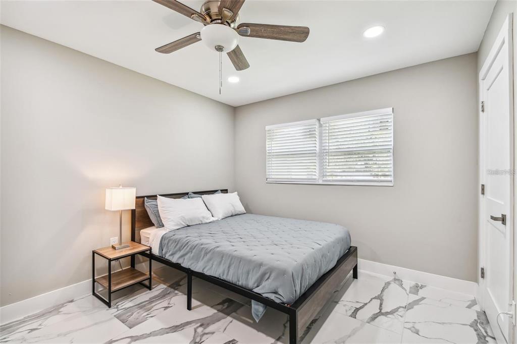 2042 Craft Lane Sarasota, FL 34239 - Photo 64 of 100 a bedroom with a bed and window