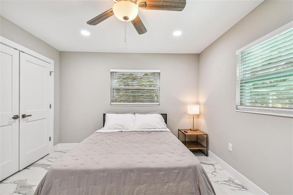 2042 Craft Lane Sarasota, FL 34239 - Photo 69 of 100 a bedroom with a bed and a window