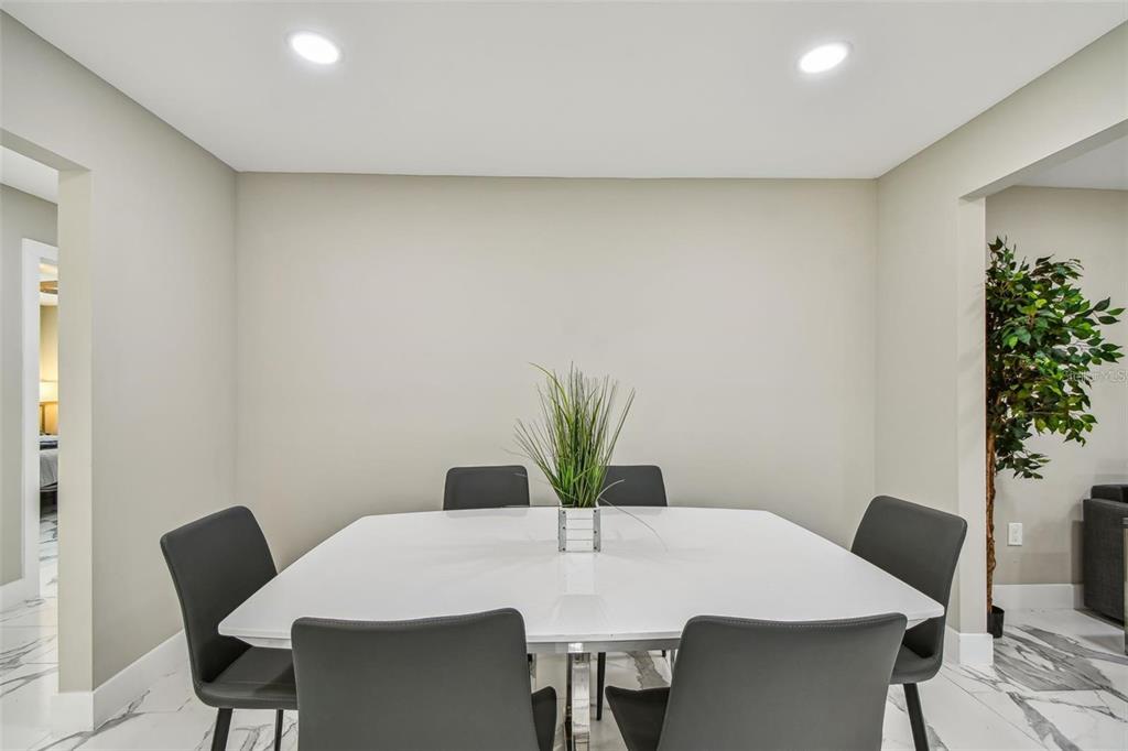 2042 Craft Lane Sarasota, FL 34239 - Photo 79 of 100 a view of a dining room with furniture and wooden floor