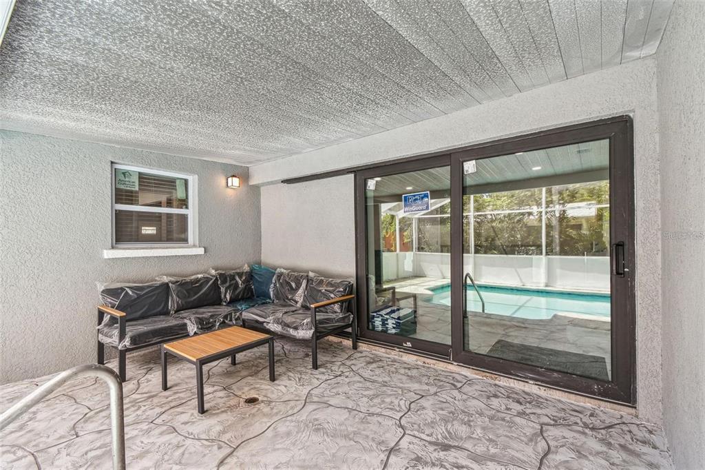 2042 Craft Lane Sarasota, FL 34239 - Photo 94 of 100 a living room with furniture and a floor to ceiling window