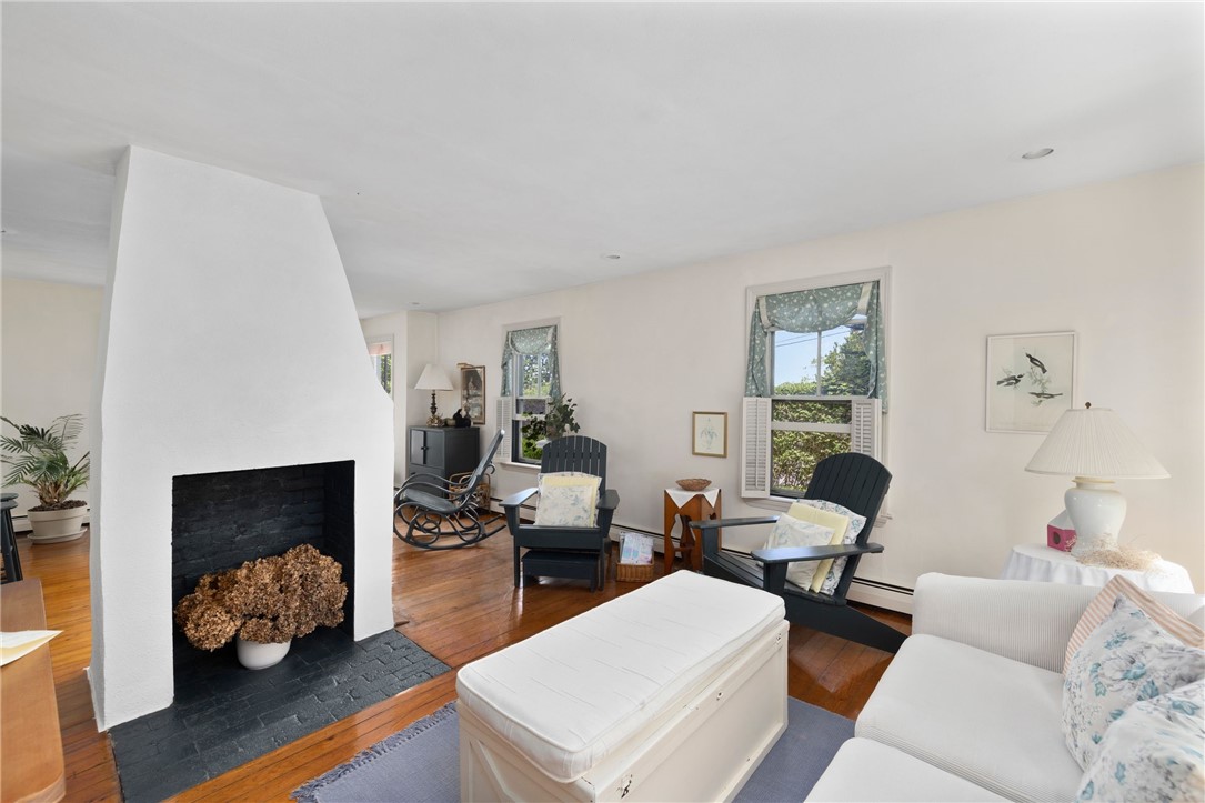 37 Continental Drive Middletown, RI 02842 - Photo 28 of 50 GH Wood burning fireplace in the open living, dining area in the Guest House.